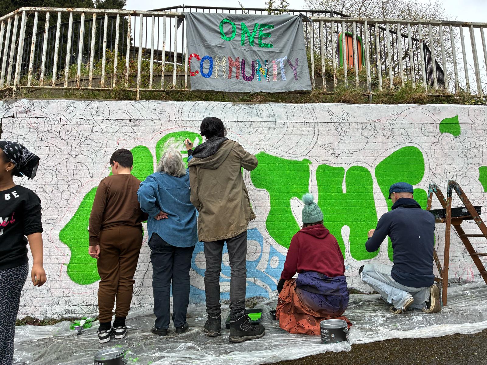 Residents painting a mural