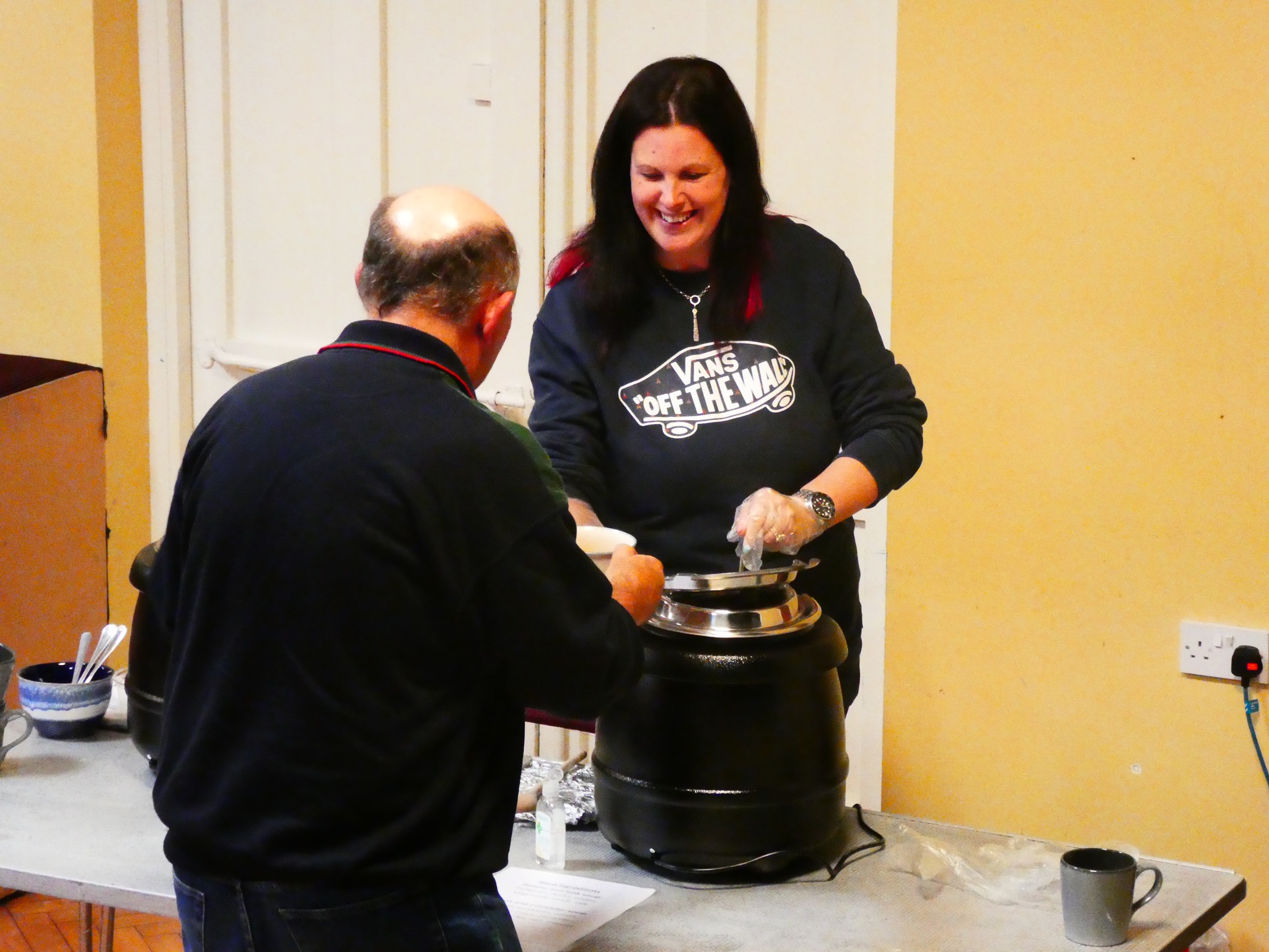 Image of Amanda serving soup to a resident